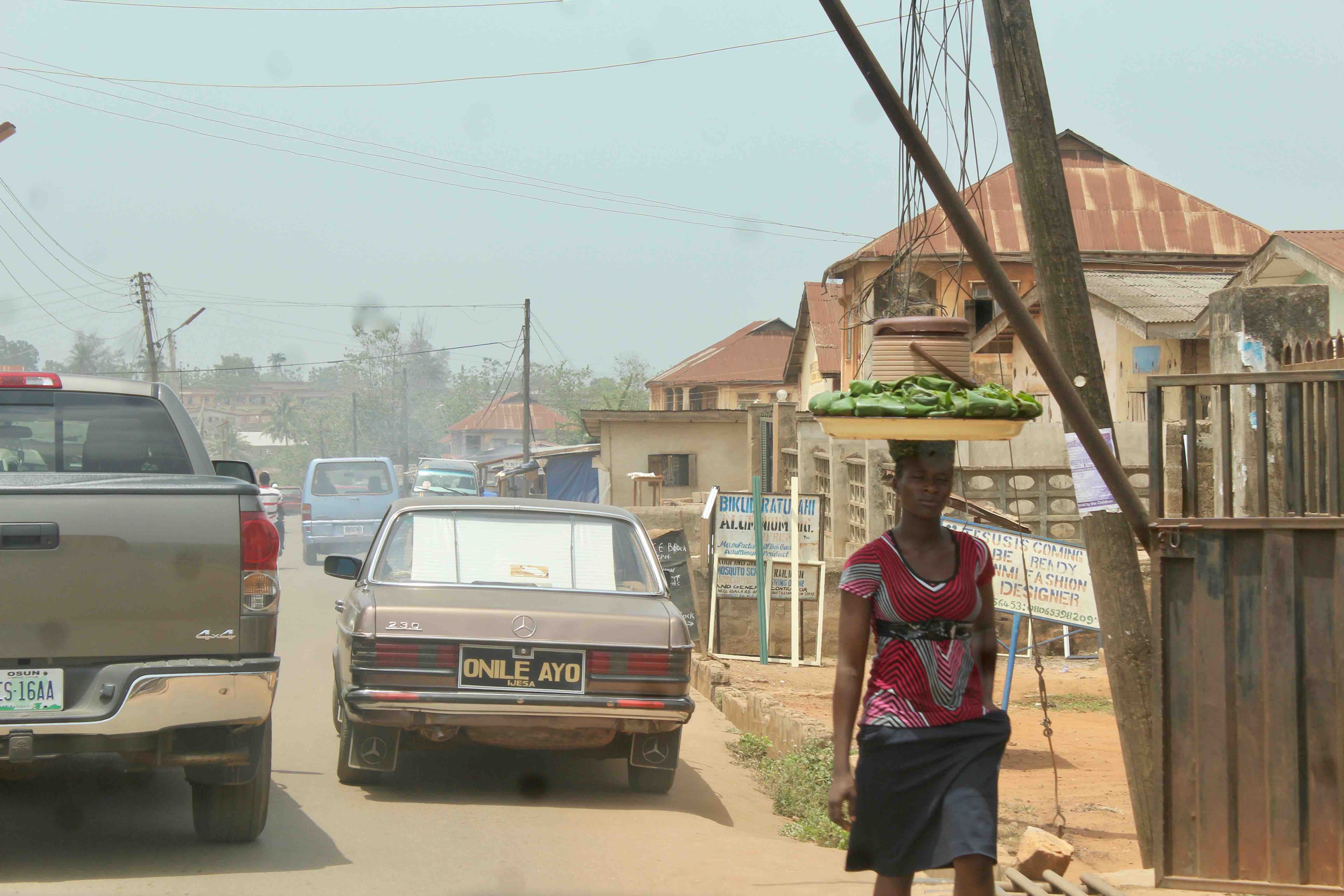 Woman street hawking eko in Ilesa, Osun State, Nigeria. #JujuFilms