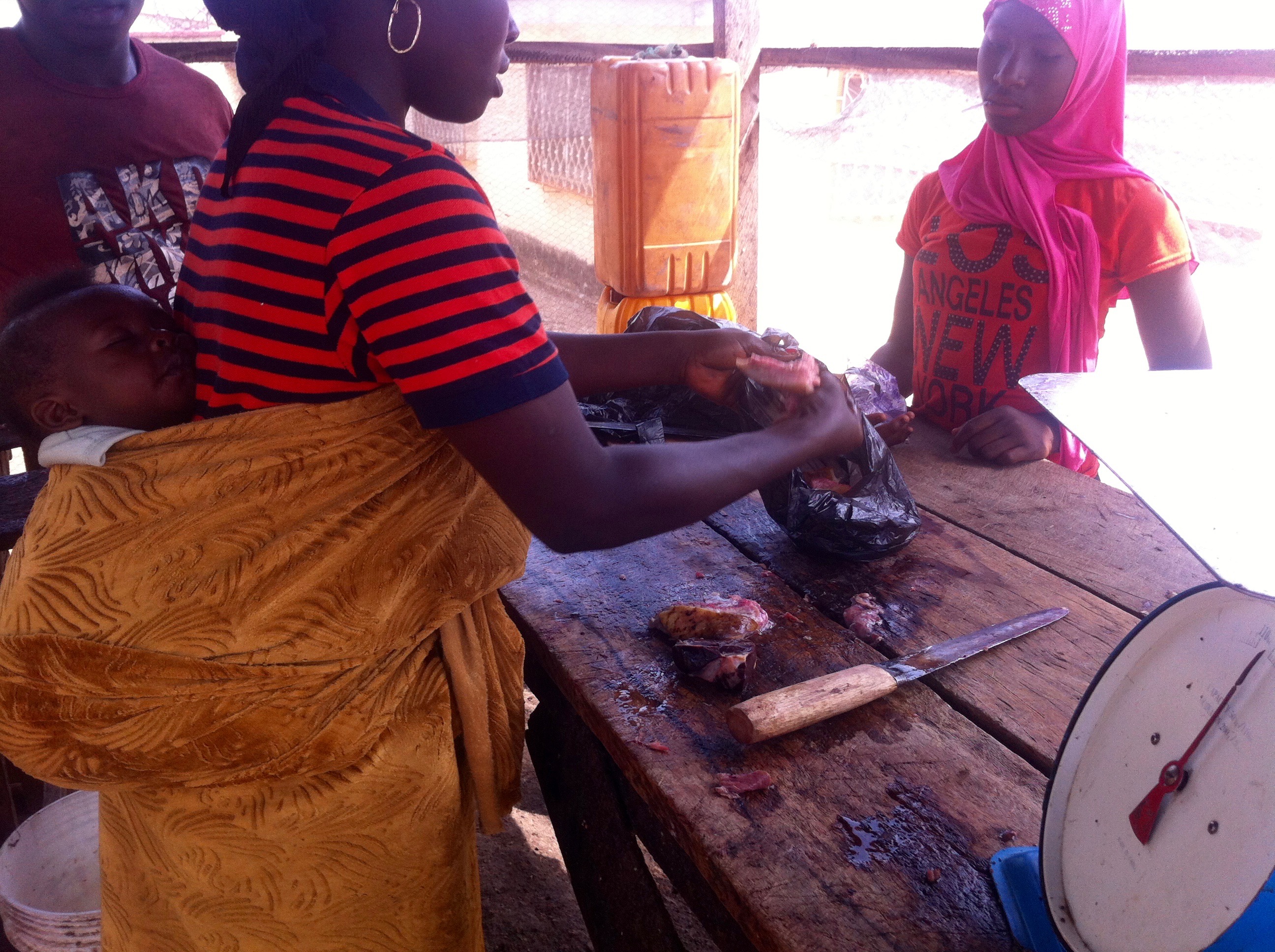 Female Butcher in Isokun