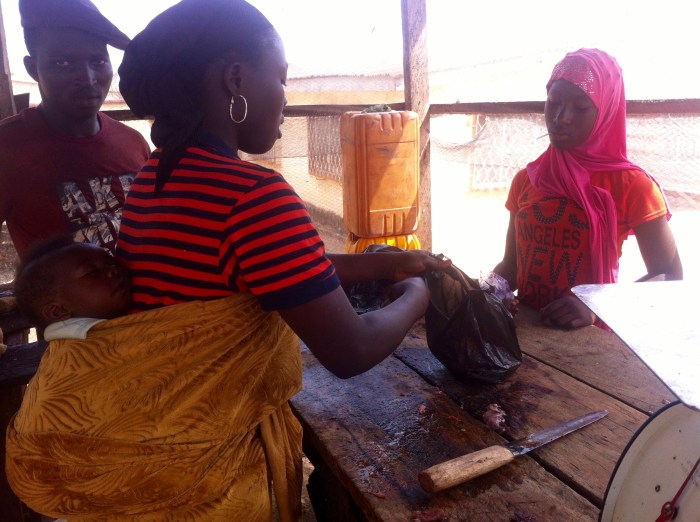 Female Butcher in Isokun