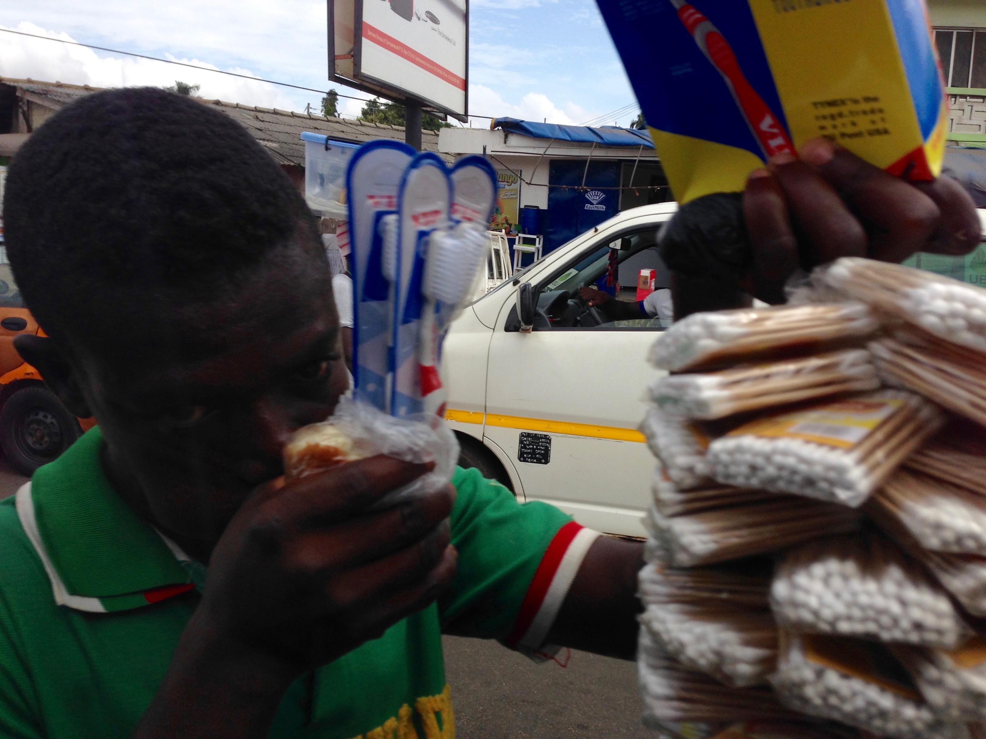 Hawking cotton swabs & toothbrush in Accra Ghana.