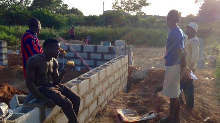 Girl selling boiled corn at construction site, Ushafa Village, FCT, Nigeria. #JujuFilms