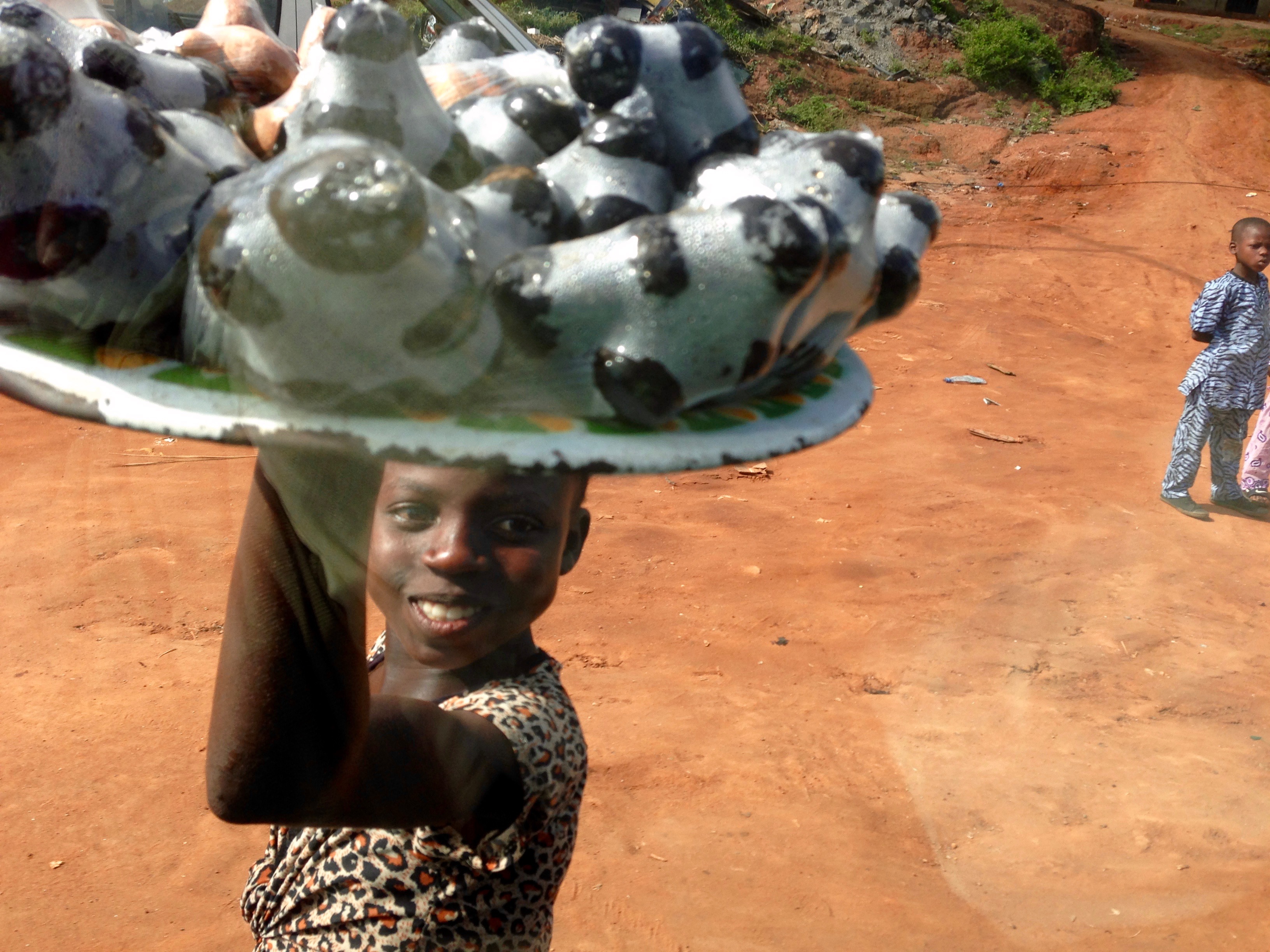 Girl roadside hawking Asala and Bitter Kolas, Igbara Oke, Ondo, Nigeria. #JujuFilms