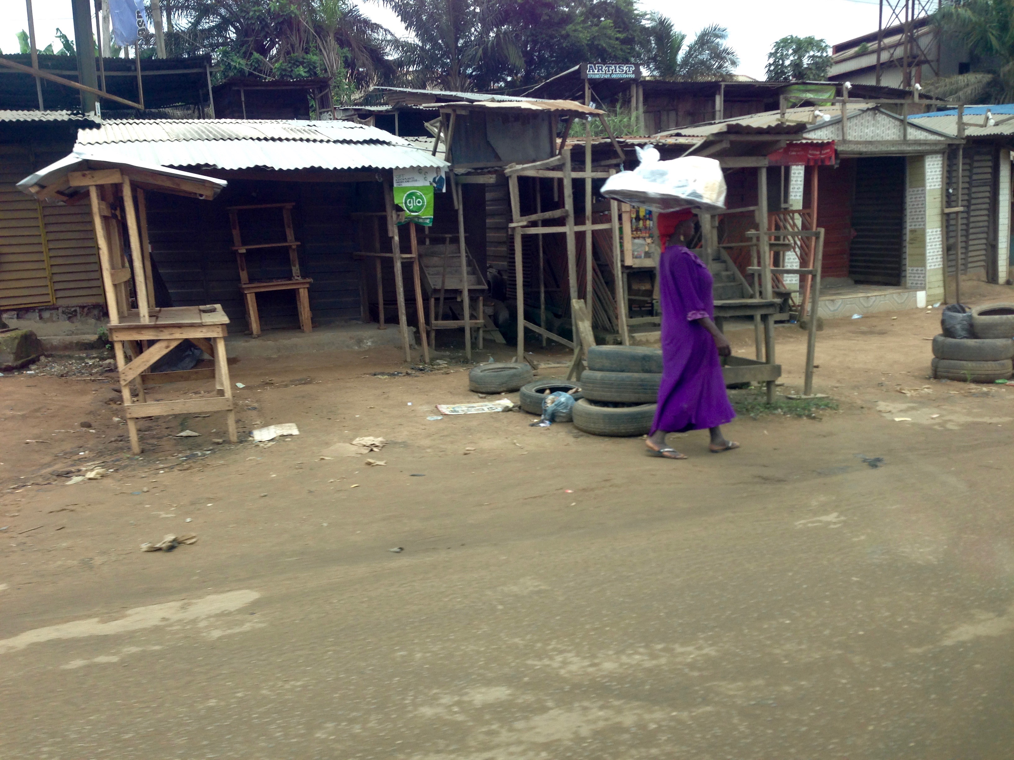 Woman hawking bread in Ilogbo, Lagos, Nigeria. #JujuFilms