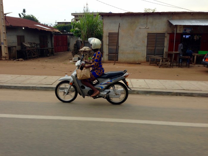 Female motorcyclist in Cotonou, Benin. #JujuFilms