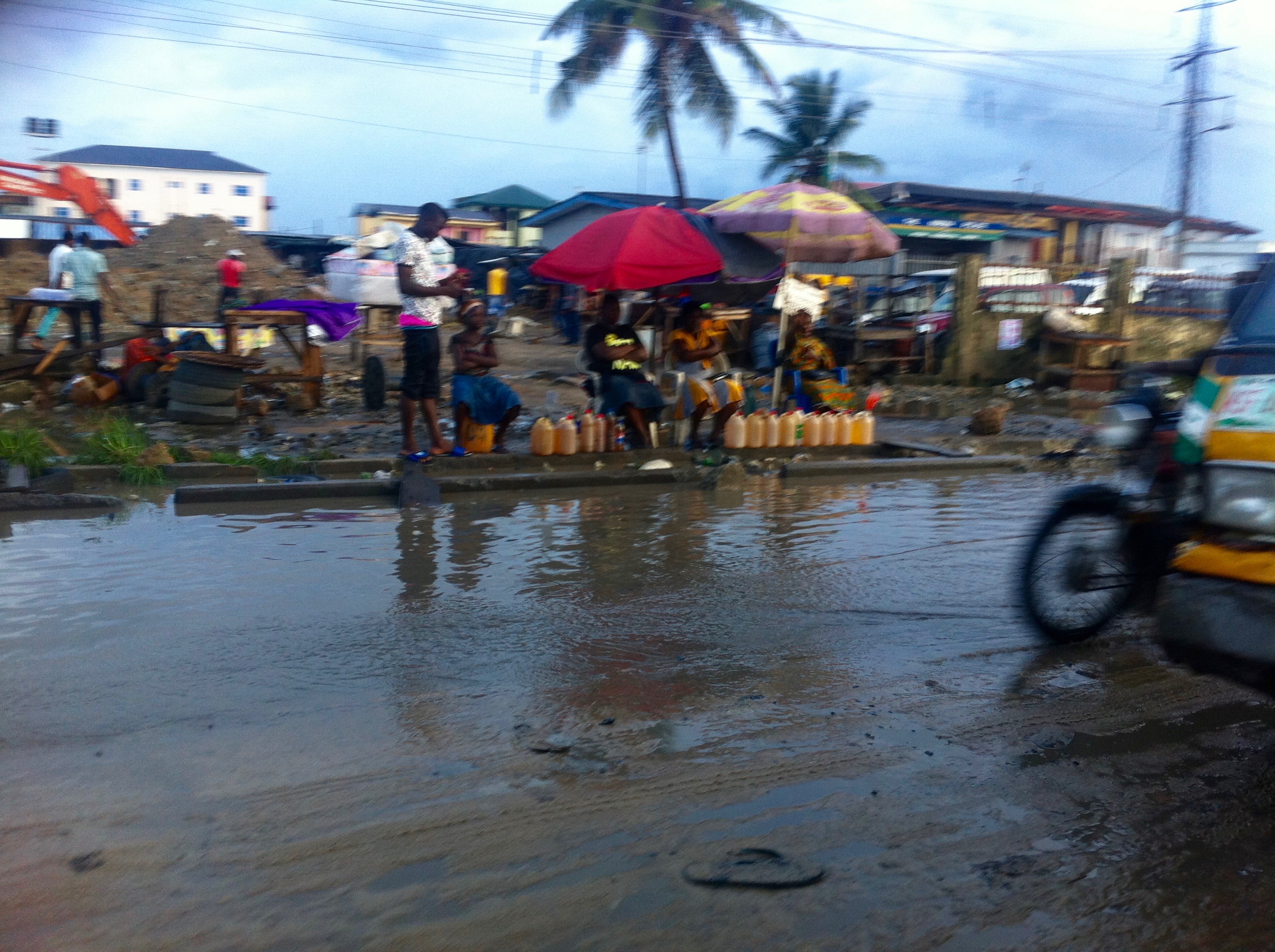 Women selling petrol by the roadside, Lagos, Nigeria. #JujuFilms