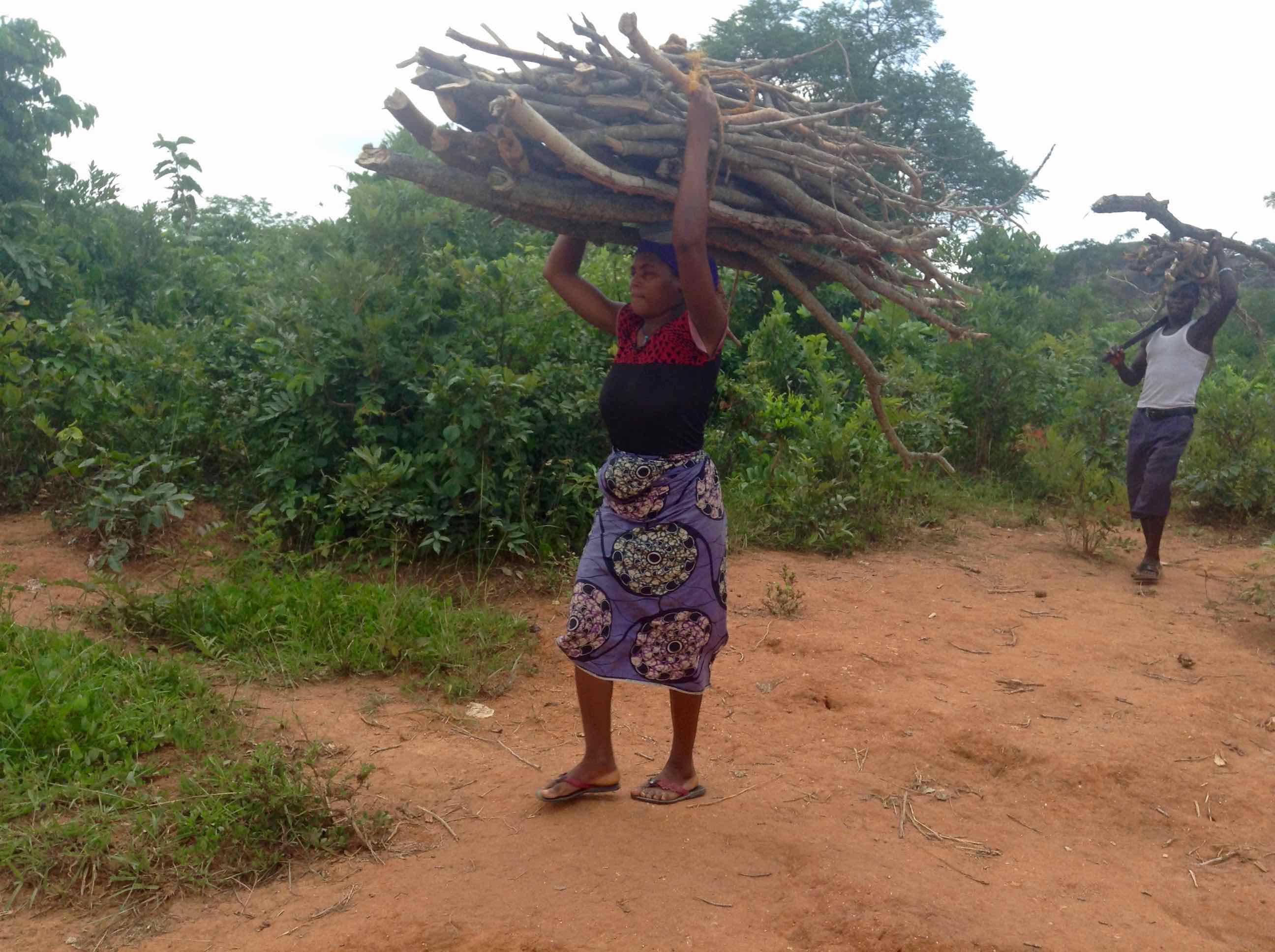 Gbagyi Woman and man fetching firewood in Ushafa Village, FCT, Nigeria, #JujuFilms