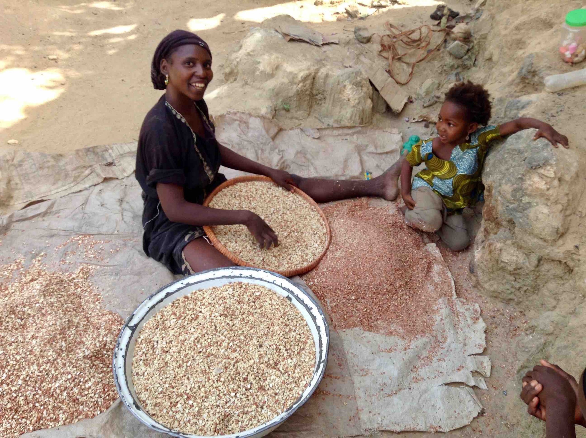 Hausa woman sorting groundnuts for kuli kuli in Langa Langa Village, Nasarawa State, Nigeria. #JujuFilms