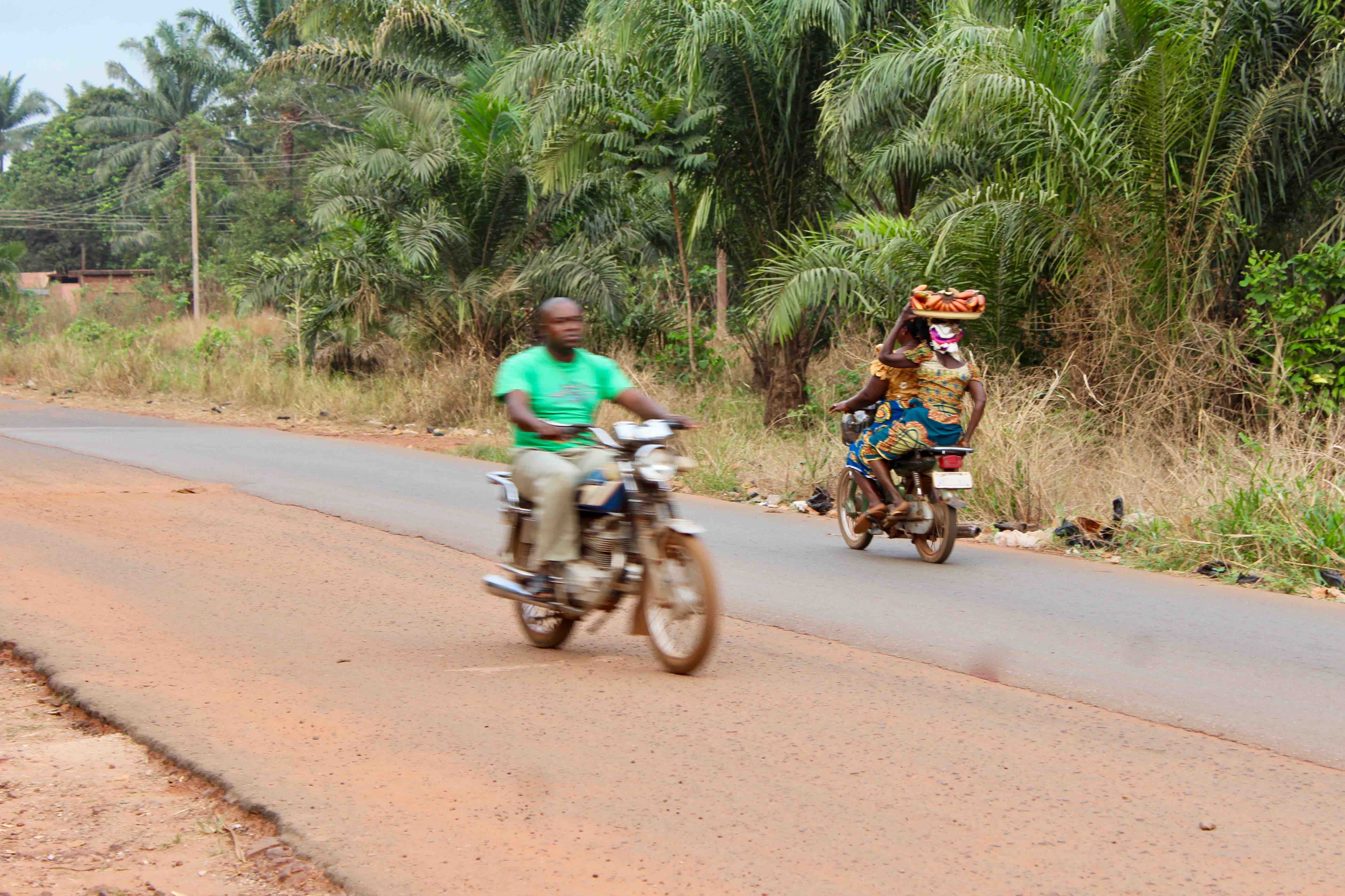 Igbo women and man, motorcycling, Obolo Village, Enugu State, Nigeria. #JujuFilms